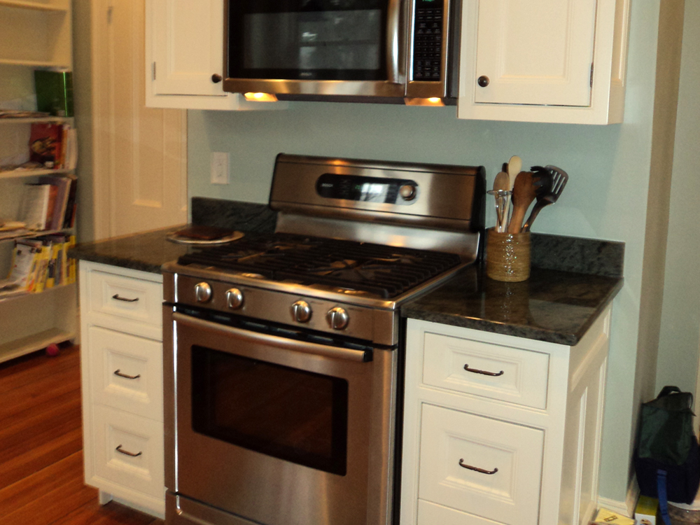 stove and white cabinets