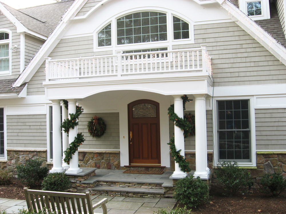 entrance with overhang that's also a balcony