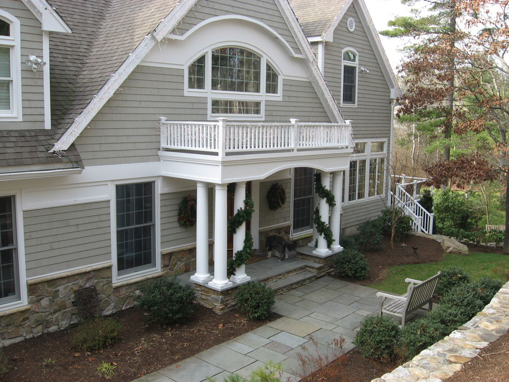 entrance with overhang that's also a balcony