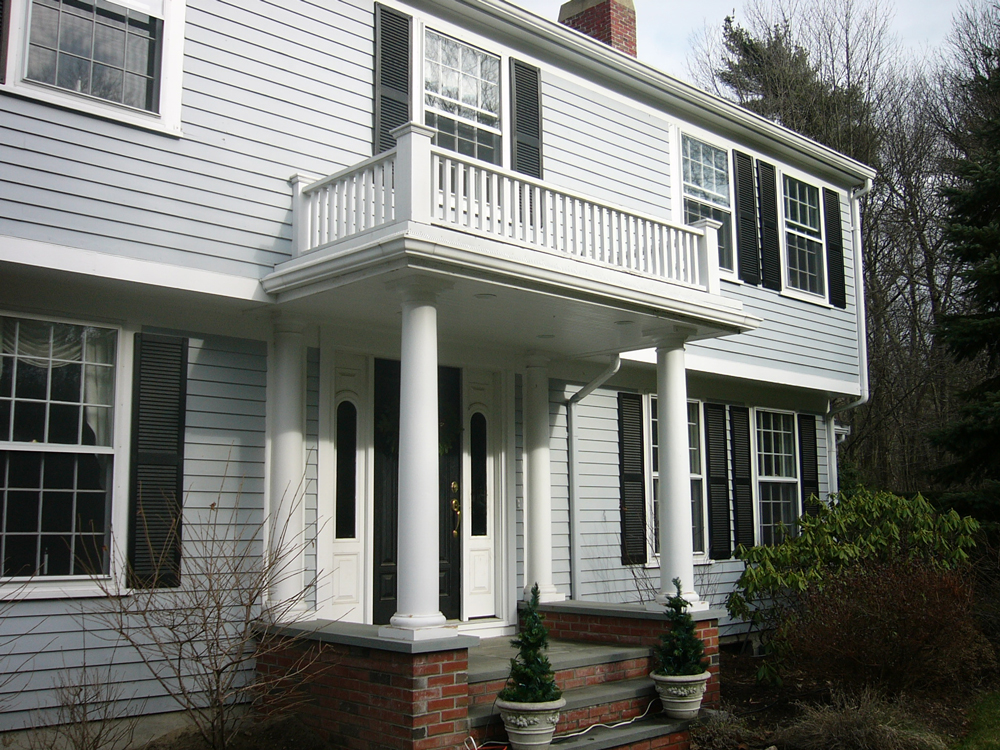 entrance with overhang that's also a balcony