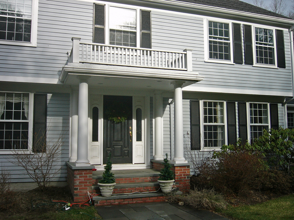 entrance with overhang that's also a balcony